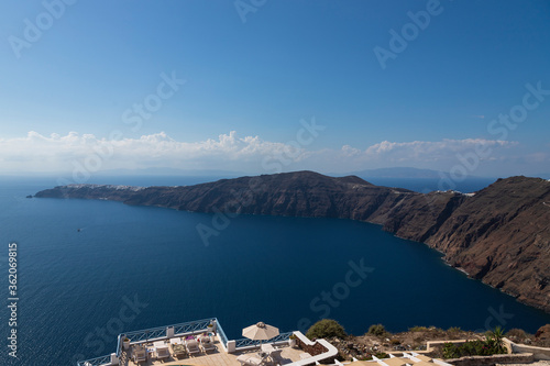 Coast and sea landscape at Megalochori on Santorini island in Greece.
