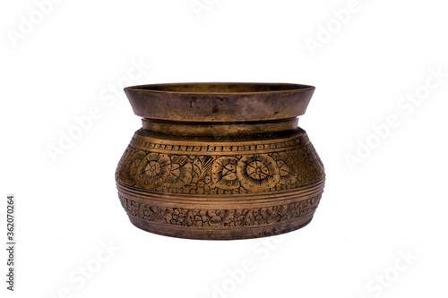 Old clay / copper / bronze pot / vase / bowl with ornamental engraving isolated on white studio background