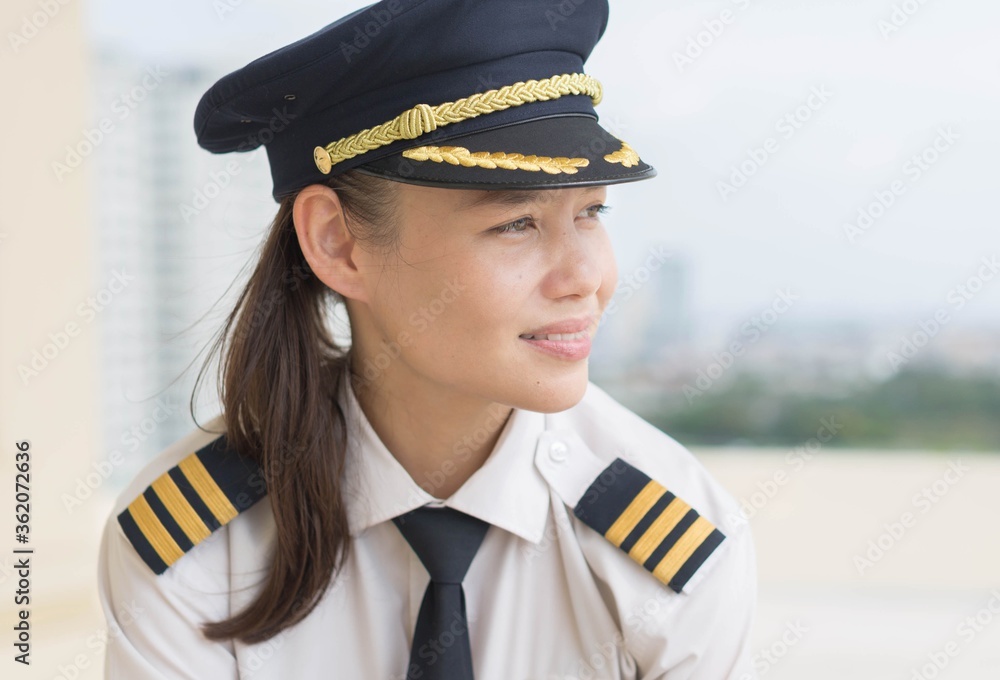 Female pilot sitting at the airport, portrait. Female pilot sitting at the airport, portrait.