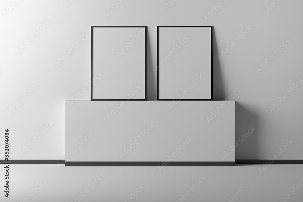 Two vertical A4 photo image frames in an empty interior Two vertical A4 photo image frames in an empty interior