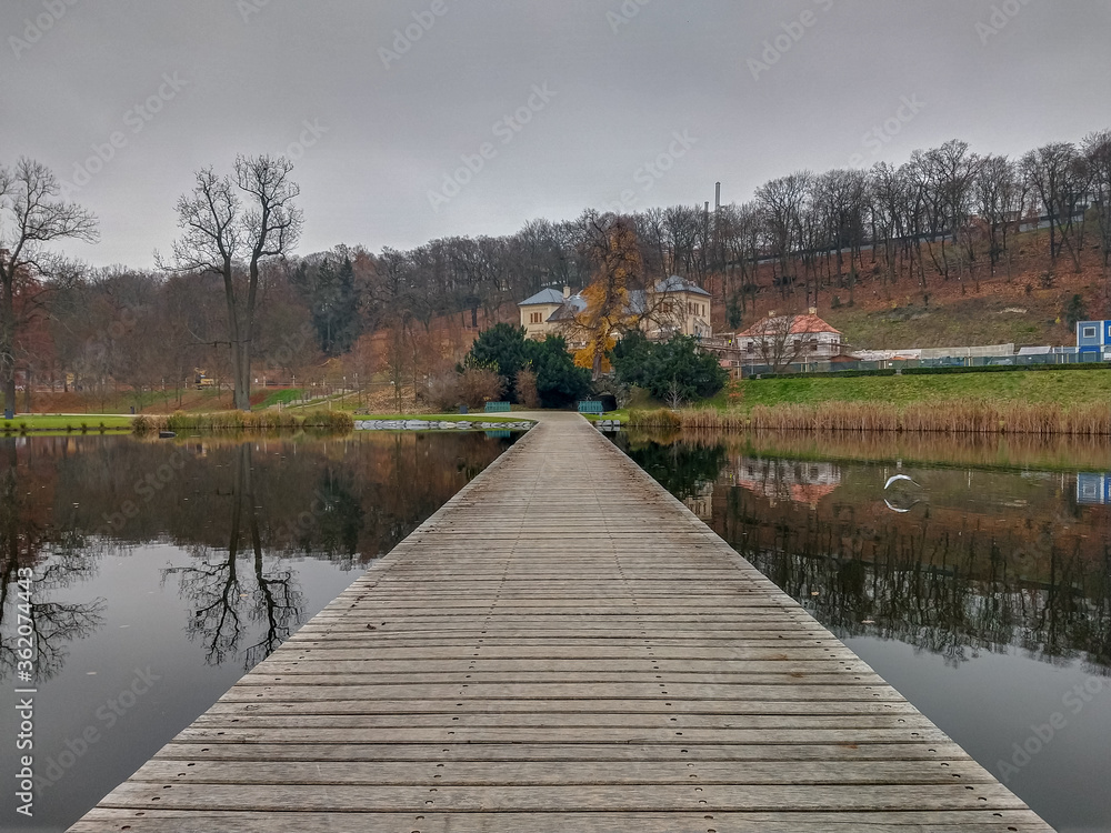 Fototapeta premium Bench autumn park and lake