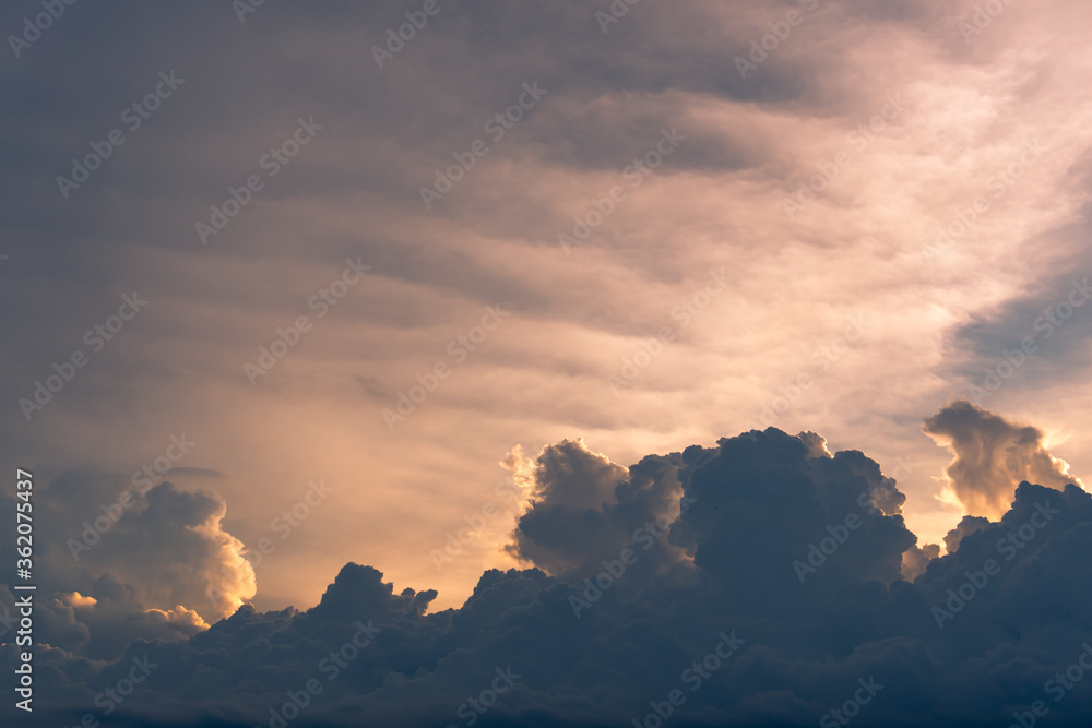 Sunset background, scenery of dramatic sky in evening, with storm clouds