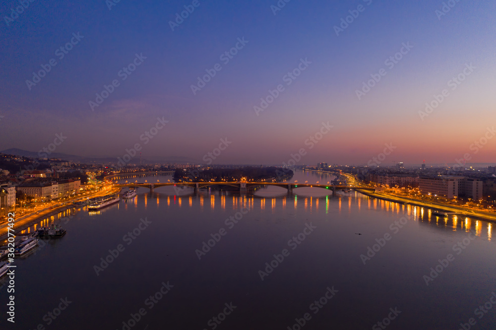 Aerial drone shot of Danube river with Margaret Island in Budapest dawn