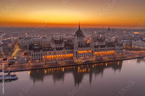 Aerial drone shot of Hungarian Parliament lights off before sunrise in Budapest dawn © Davidzfr