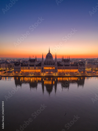 Aerial drone shot of Hungarian Parliament lights off before sunrise in Budapest dawn