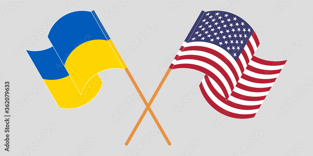 Crossed and waving flags of the Ukraine and the USA Crossed and waving flags of the Ukraine and the USA