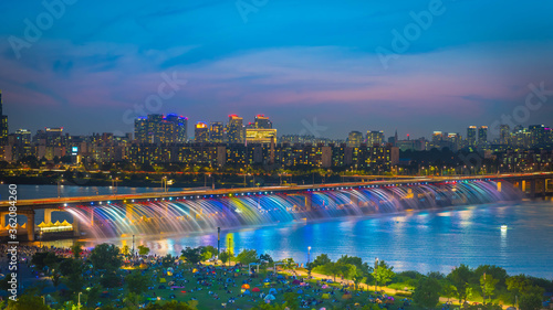 A night view of Banpo Bridge, Seoul city with Rainbow Fountain. Industrial, light.
