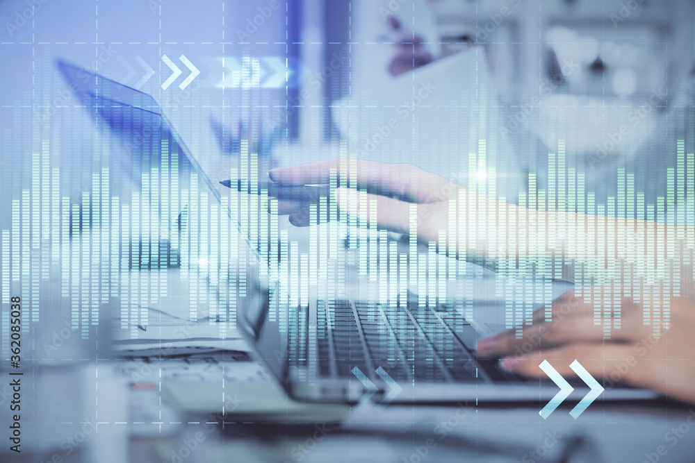 Multi exposure of woman hands typing on computer and financial graph hologram drawing. Stock market analysis concept. Multi exposure of woman hands typing on computer and financial graph hologram drawing. Stock market analysis concept.