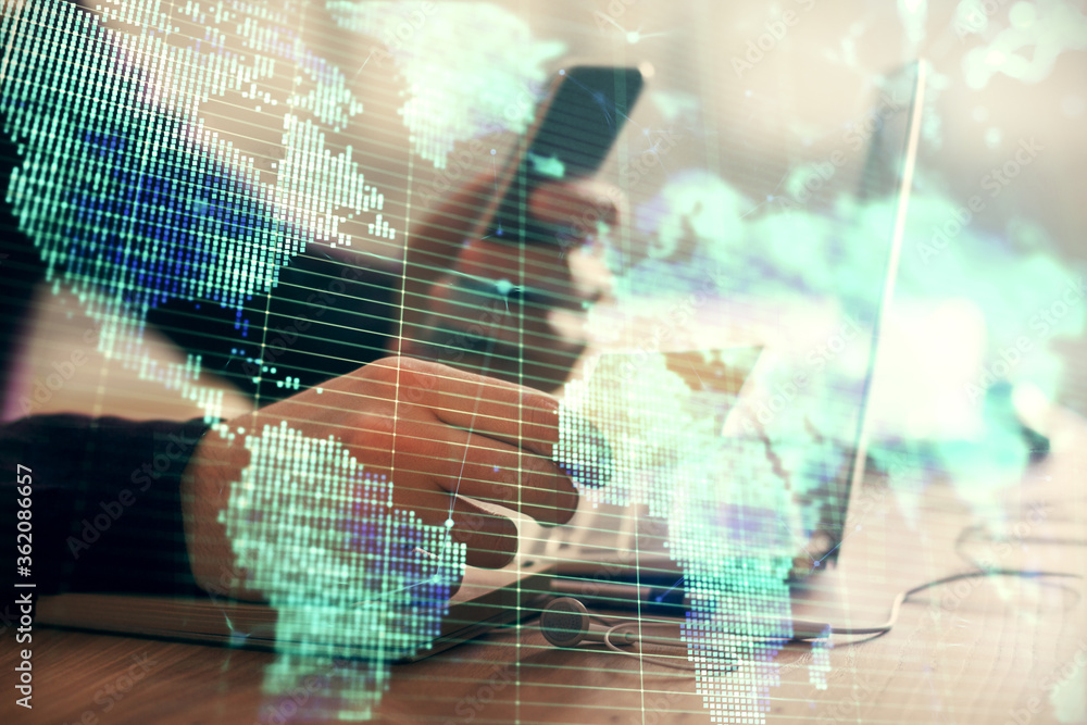 Obraz premium Double exposure of man's hands holding and using a phone and international business theme drawing.