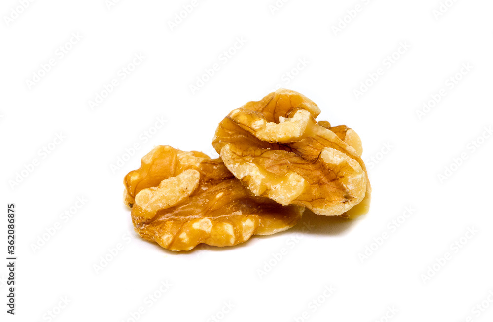 Natural walnut on white background. Cracked and cleaned nut kernel. Organic food studio photo. Natural walnut on white background. Cracked and cleaned nut kernel. Organic food studio photo.