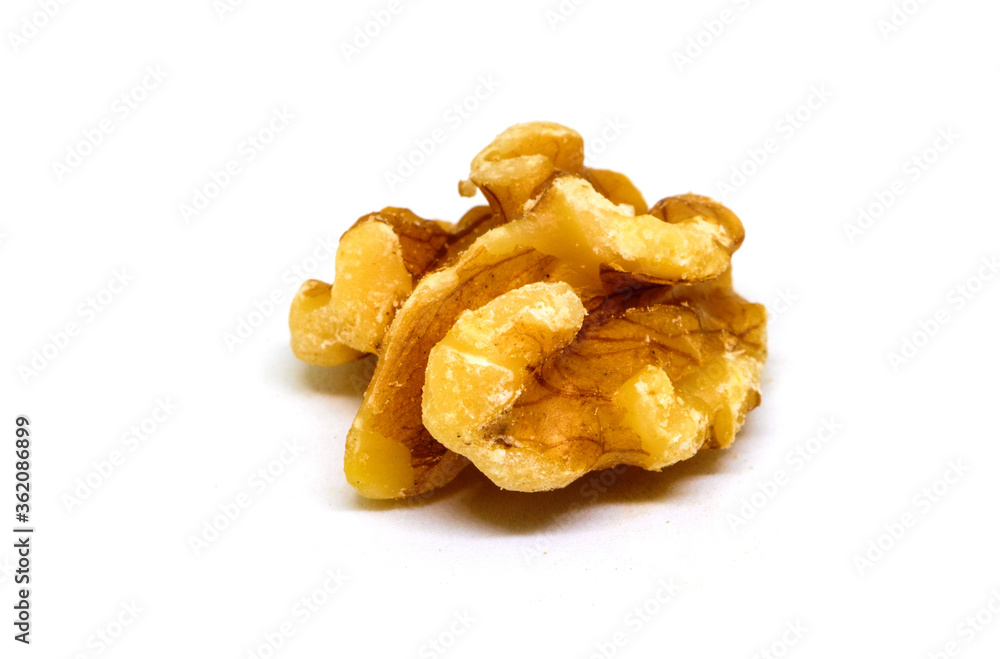 Natural walnut on white background. Cracked and cleaned nut kernel. Simple organic food. Tasty healthy snack Natural walnut on white background. Cracked and cleaned nut kernel. Simple organic food. Tasty healthy snack