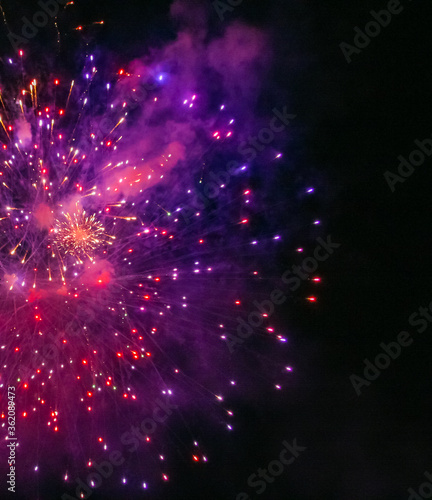 Colorful background Defocused lights colorful fireworks in the night sky as background