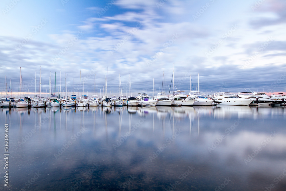 yachts in marina on  calm day