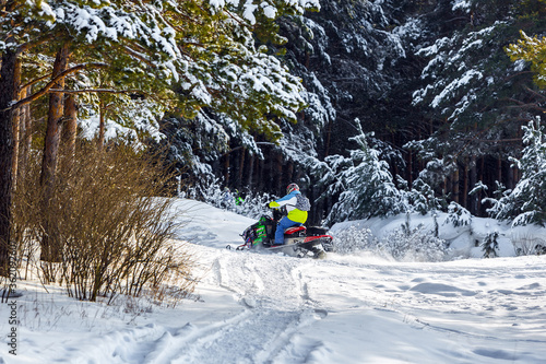 Snowmobile in the winter forest. Siberia