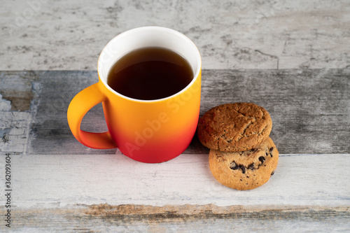 A cup of tea with oatmeal cookies