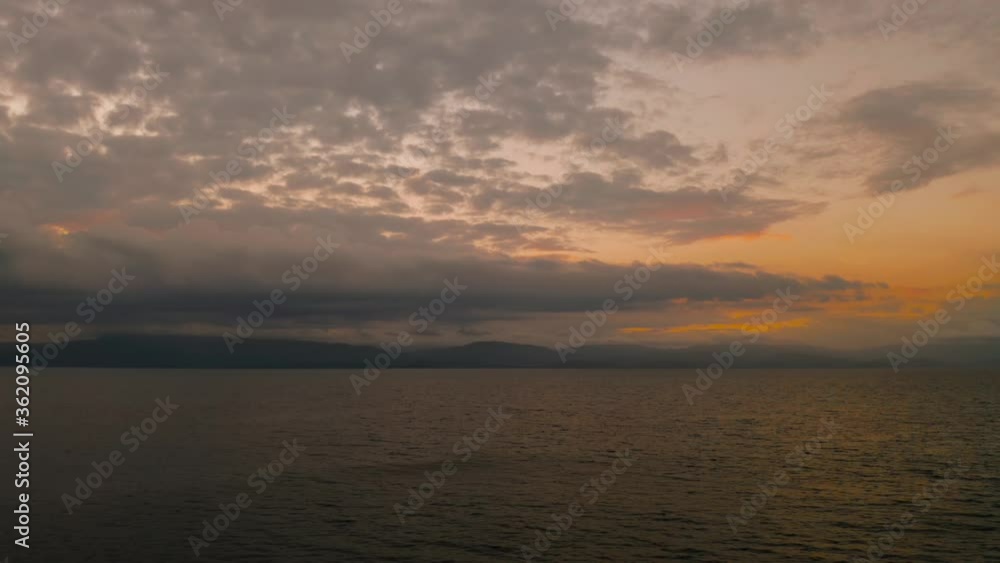 Beauty of colorful sky during the sunset from above. Beautiful sunset background from the colorful beams on the sky. Sunset over ocean. Seascape, Summer and travel vacation concept Beauty of colorful sky during the sunset from above. Beautiful sunset background from the colorful beams on the sky. Sunset over ocean. Seascape, Summer and travel vacation concept