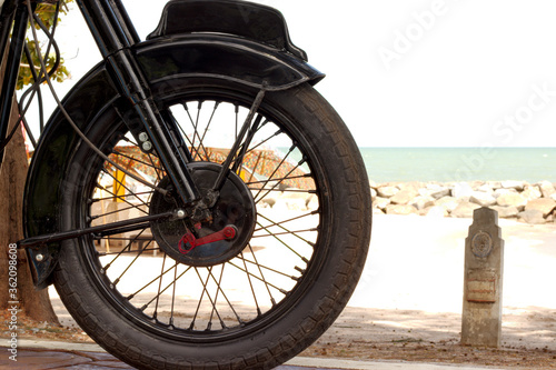 Motorcycle wheel at the beach