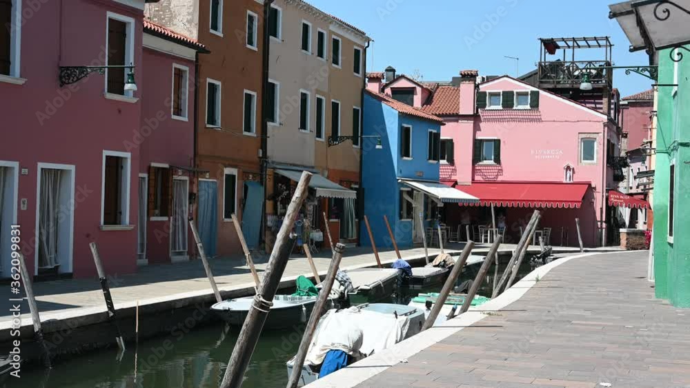 Burano, Venice - Colorful buildings between the canals of the lagoon city Burano, Venice - Colorful buildings between the canals of the lagoon city