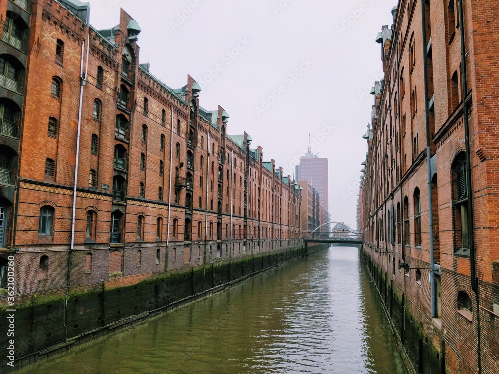 The Speicherstadt in Hamburg, Germany is the largest warehouse district in the world where the buildings stand on timber-pile foundations, oak logs.