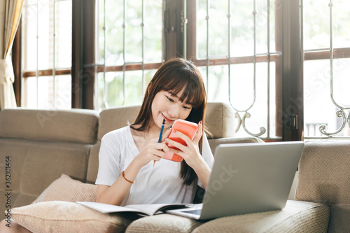 College student teenager study online stay at home using digital conference via internet with laptop