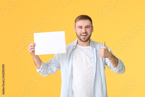 Young man with blank card s...