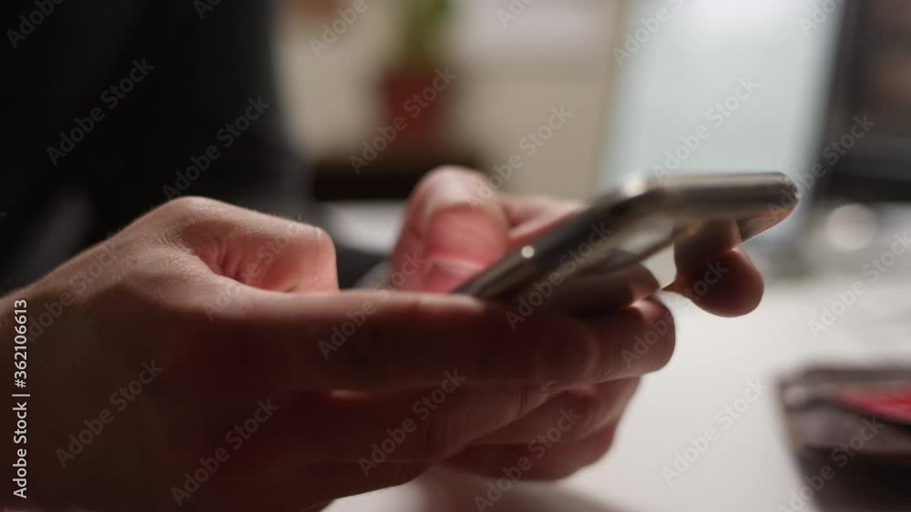 Close up of thumbs texting on a smartphone with shallow focus Close up of thumbs texting on a smartphone with shallow focus
