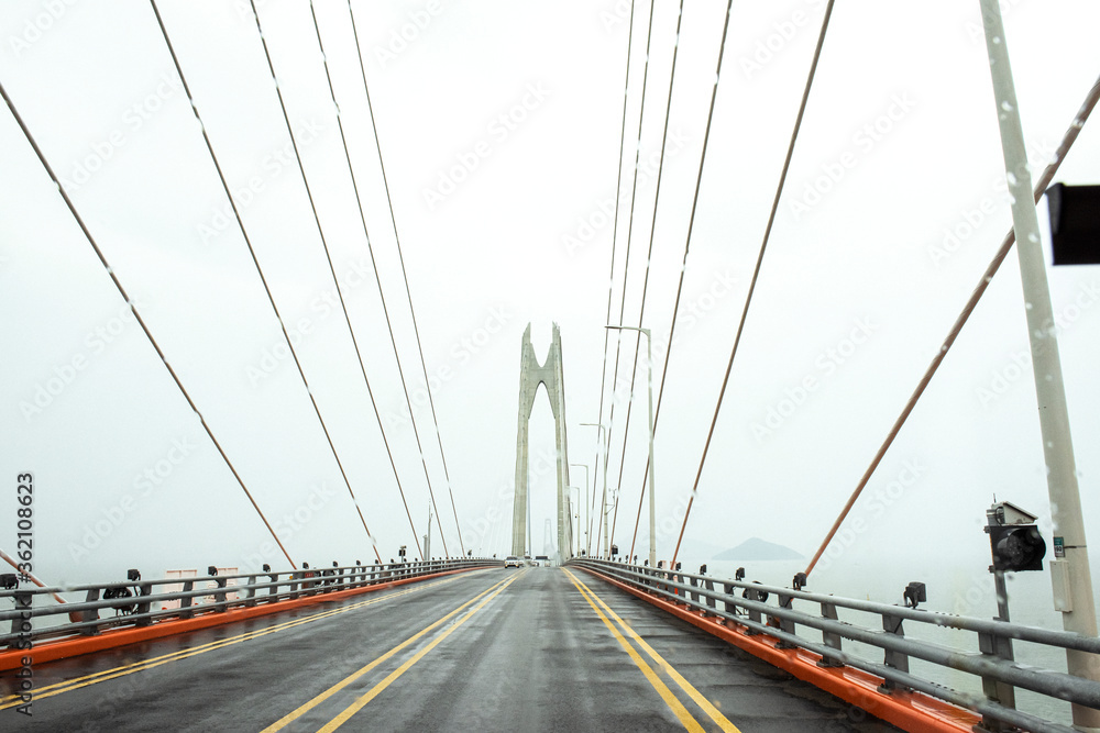 The gigantic grand bridge and beautiful skyline panorama at rainy day.