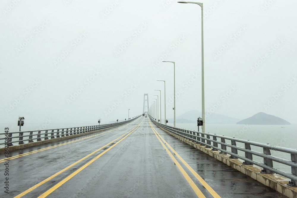 The gigantic grand bridge and beautiful skyline panorama at rainy day.