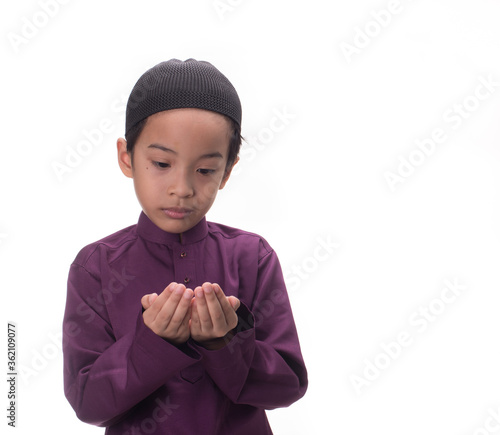 A Muslim kid with various poses isolated over white
