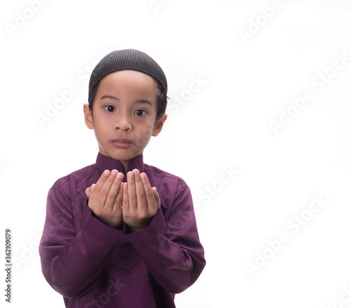 A Muslim kid with various poses isolated over white