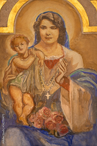 BARCELONA, SPAIN - MARCH 3, 2020: The modern fresco of Madonna in the church Parroquia Santa Teresa de l'Infant Jesus by Francisco Labarta (20. cent.).