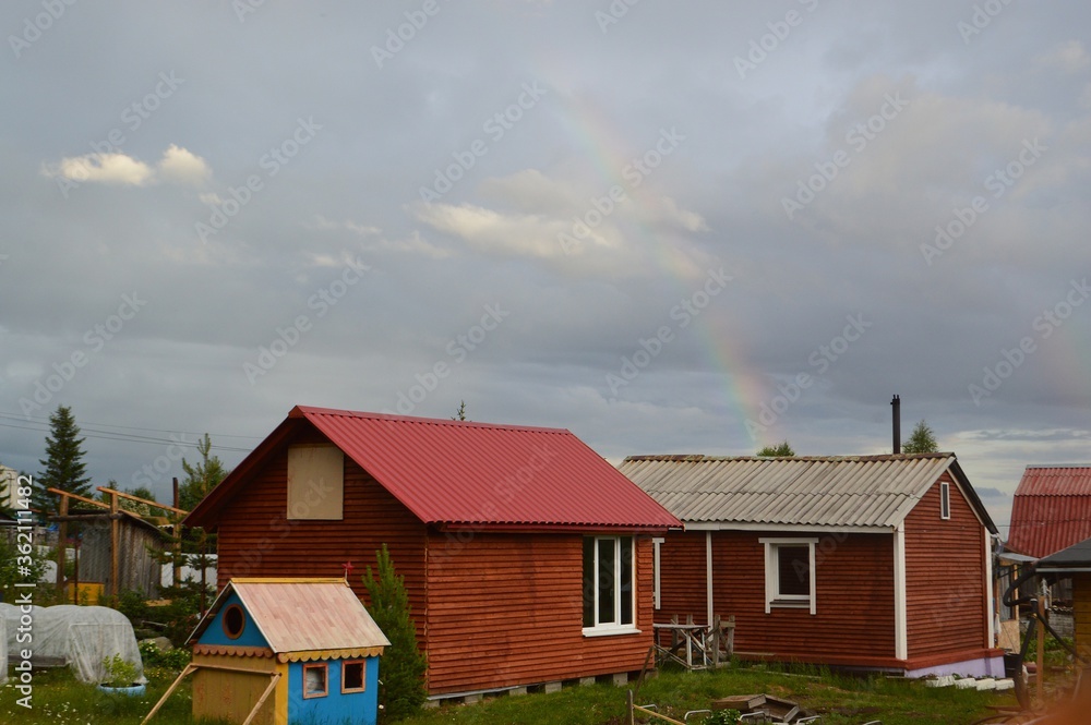 Naklejka premium rainbow at the cottage