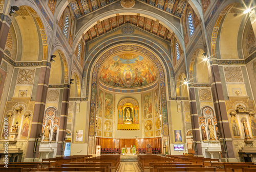 BARCELONA, SPAIN - MARCH 3, 2020: The nave of church Parroquia Santa Teresa de l'Infant Jesuswith the frescoes by Francisco Labarta (20. cent.). photo