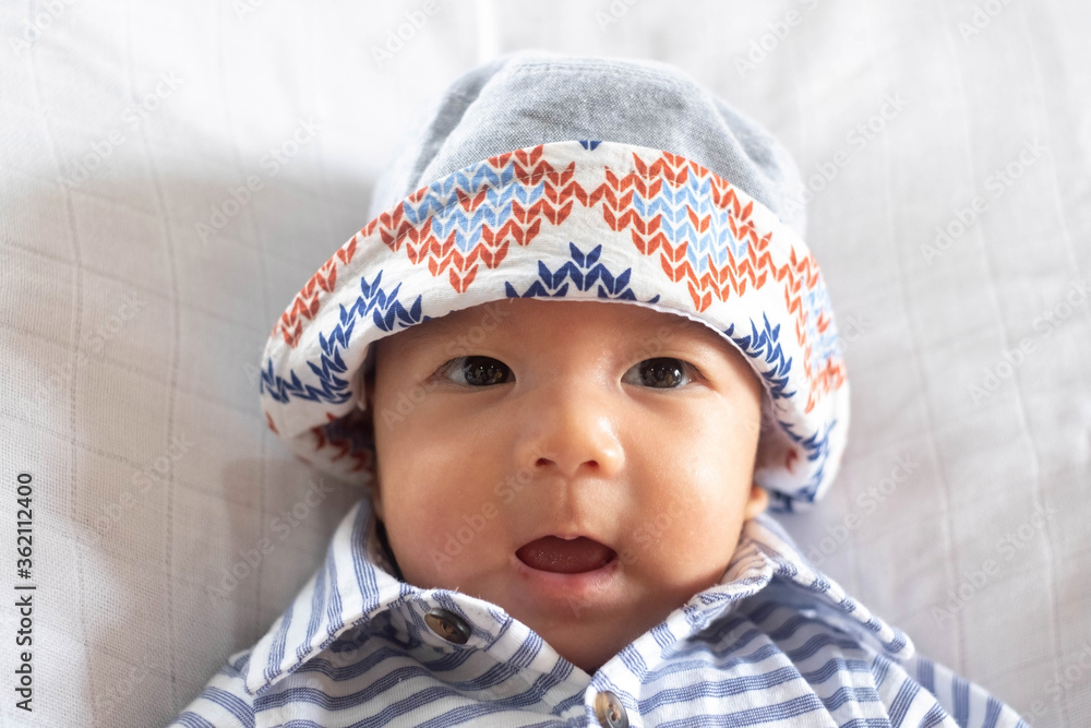 The Portrait of Asian Baby Infant Boy wearing bucket hat The Portrait of Asian Baby Infant Boy wearing bucket hat
