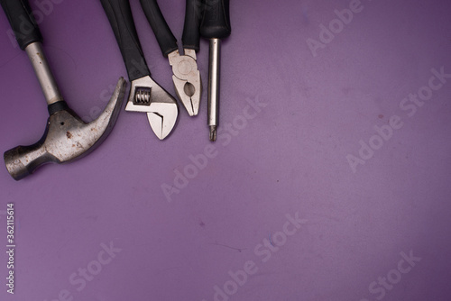 Set of tools isolated over purple surface