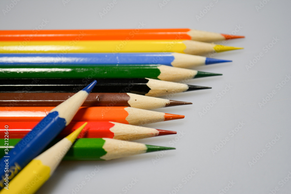 Fototapeta premium colored pencils with notebook for drawing on paper and fun