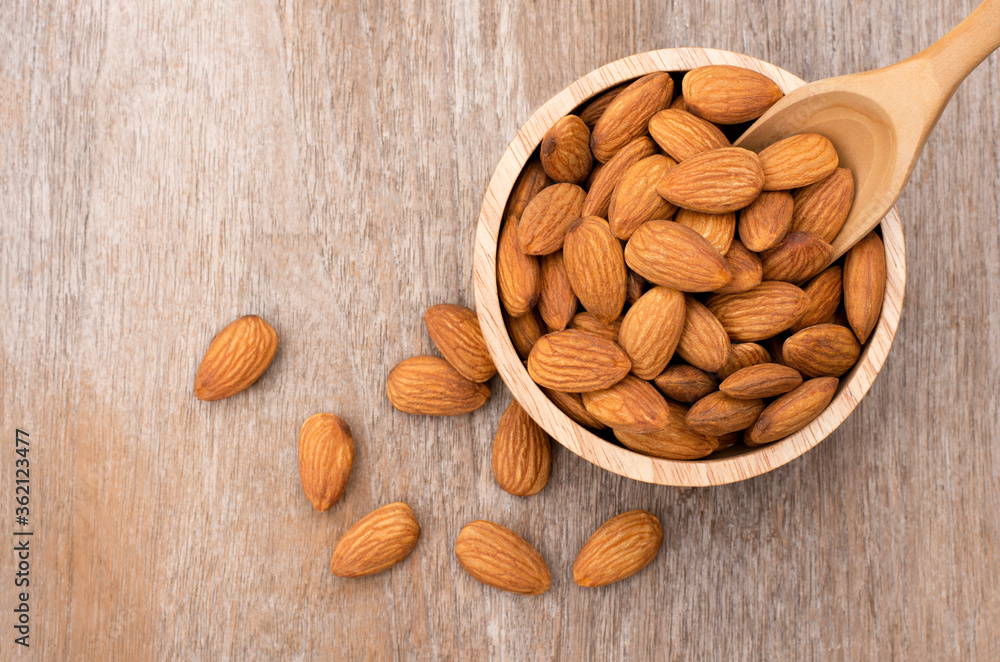 almonds in a wooden bowl almonds in a wooden bowl