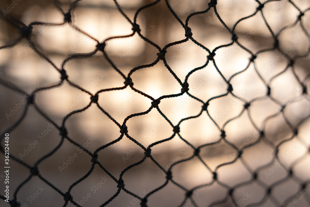 Naklejka premium Net pattern close up. Rope net. Soccer, football, volleyball, tennis and tennis net pattern. Fisherman hunting net rope texture
