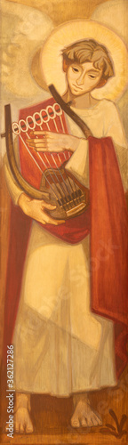 Принти на полотні BARCELONA, SPAIN - MARCH 3, 2020: The painting of angel plaing on the zither in the church Santuario Nuestra Senora del Sagrado Corazon by Navarro Perez-Dolz (1989)