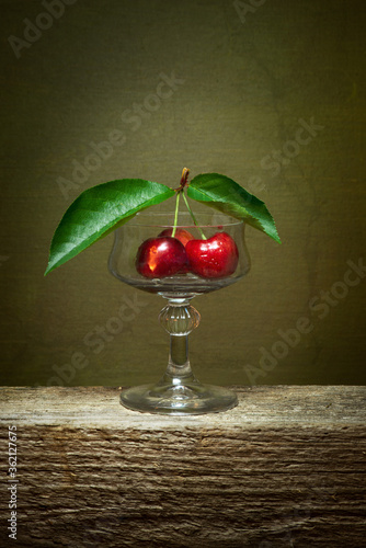 cherry on a table fruit red glass