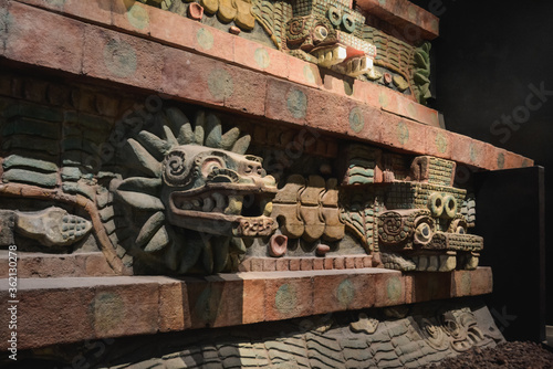 Replica of decorations on the front facade of the Pyramid of the Feathered Serpent, showing ancient gods heads, at the National Museum of Anthropology