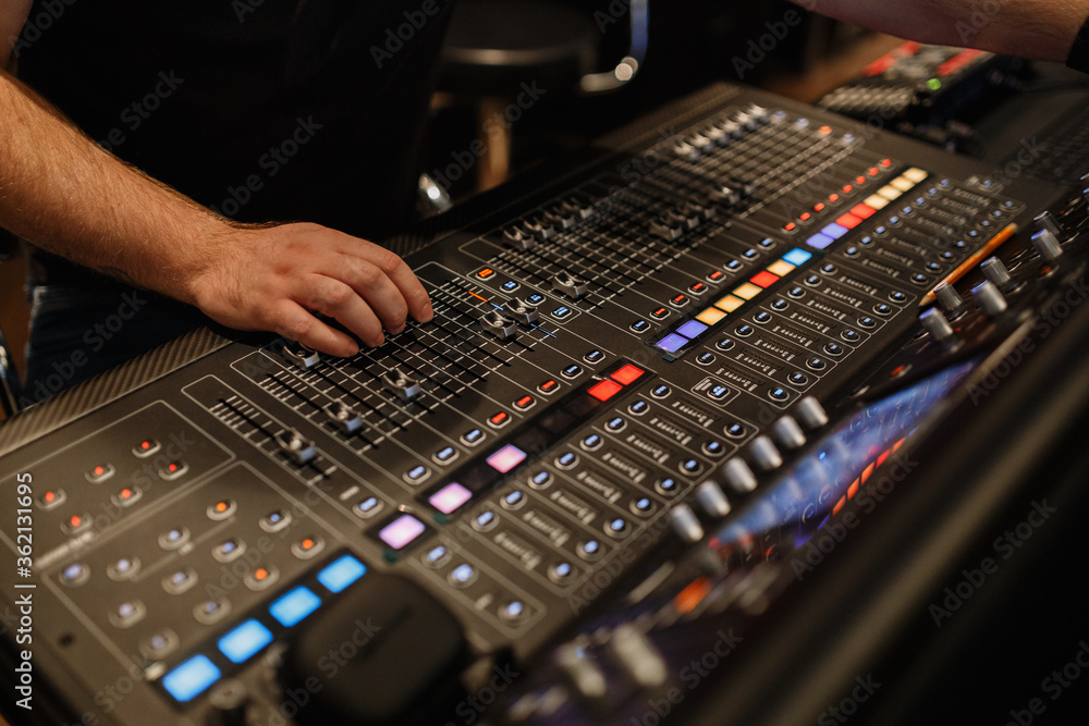 mixing console, a lot of faders and buttons. sound engineer hand mixing console, a lot of faders and buttons. sound engineer hand