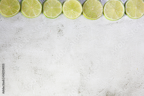 Fresh lemon slices on gray background. Copy space.
