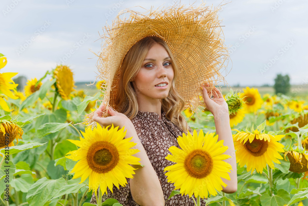 Portrait of a pretty girl in a field of sunflowers. Portrait of a pretty girl in a field of sunflowers.