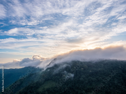 landscapes beautiful of clouds moving over mountain. Foggy morning landscape and ray of sunlight at Phu Tub Berk, Phetchabun, Thailand. It’s extremely popular vacation spot for refreshing cool climate