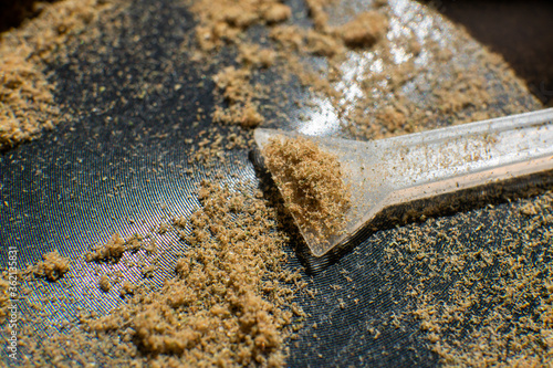 Kief macro in grinder. Marijuana Close up. Sativa medical health. photo