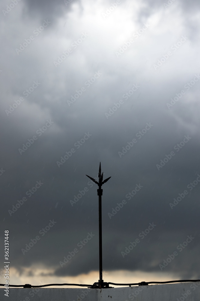 Obraz premium Lightning rod or lightning conductor (Copper pole) on the roof of building for protection lightning and thunder. 