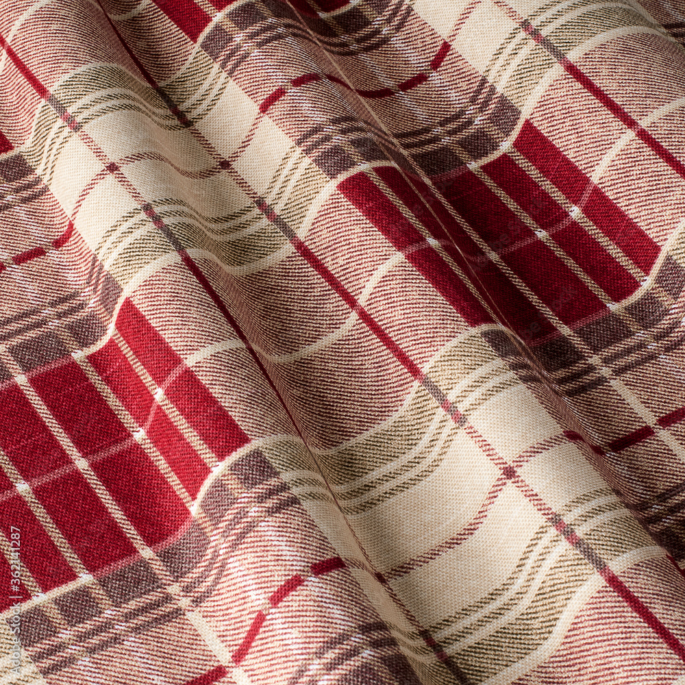 Drawing ornament on a red cage fabric. Fabric with natural texture, Cloth backdrop. Drawing ornament on a red cage fabric. Fabric with natural texture, Cloth backdrop.