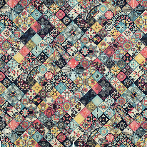 Drawing ornament on colorful patchwork fabric. Fabric with natural texture, Cloth backdrop.