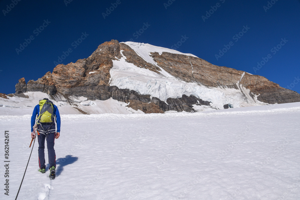 Alpinist ascending the Jungfrau in the Berner Oberland, Switzerland